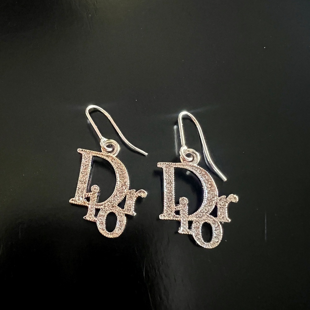 Authentic Christian Dior Silver Logo dangle earrings with rhinestones